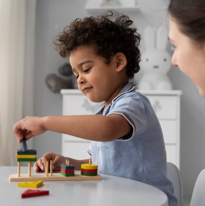 Close up on child enjoying didactic game